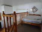 Double bed in gallery bedroom