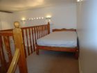 Double bed in gallery bedroom